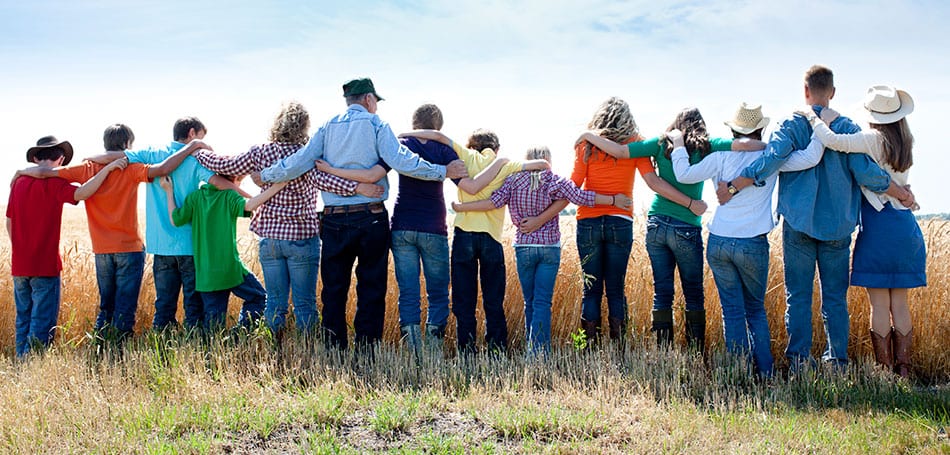 photo of a family connected in a line after sponsoring family members to immigrate to Canada